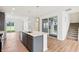 Modern kitchen with an island, stainless steel appliances, pendant lighting, and sliding glass doors at 9160 Anthem Ave, Plainfield, IN 46168