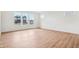 Bright living area with light wood floors and large windows offering plenty of natural light at 9160 Anthem Ave, Plainfield, IN 46168