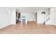 Spacious open-concept living room with wood floors and bright white walls at 9160 Anthem Ave, Plainfield, IN 46168