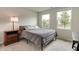Comfortable bedroom featuring two windows for natural light, plus a side table and a desk at 9829 Hulton Rd, Pendleton, IN 46064