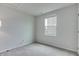 Empty bedroom ready for customization, featuring a single window and neutral carpet at 9829 Hulton Rd, Pendleton, IN 46064