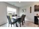 Cozy dining area with a modern table, comfortable chairs, and a sliding glass door at 9829 Hulton Rd, Pendleton, IN 46064