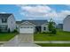 Charming single-story home featuring a two-car garage and a well-manicured front lawn at 9829 Hulton Rd, Pendleton, IN 46064