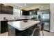 Stylish kitchen with marble countertops, dark cabinets, and stainless steel appliances at 9829 Hulton Rd, Pendleton, IN 46064