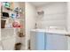 Functional laundry room featuring a washer, dryer, and shelving for convenient storage at 9829 Hulton Rd, Pendleton, IN 46064