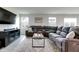 Inviting living room with comfortable reclining sofa, stylish rug, and cozy decor at 9829 Hulton Rd, Pendleton, IN 46064