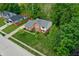 Aerial view of well-maintained home with fresh landscaping and a lush lawn at 1004 Nevelle Ln, Carmel, IN 46032