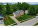 Beautiful home with brick accents and a large, well-manicured front lawn at 1004 Nevelle Ln, Carmel, IN 46032