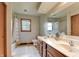 Bright bathroom featuring a tub, natural light, and a double sink vanity at 1004 Nevelle Ln, Carmel, IN 46032