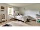 Bright bedroom with a white bed, large window, and carpeted flooring at 1004 Nevelle Ln, Carmel, IN 46032