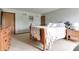 Comfortable bedroom with neutral carpet, a wooden dresser, and accents of blues and whites at 1004 Nevelle Ln, Carmel, IN 46032