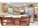 Bright kitchen with stainless steel appliances, a center island with seating, and plenty of counter space at 1004 Nevelle Ln, Carmel, IN 46032