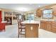 Spacious kitchen with a center island, ample counter space, and views into the adjacent living room at 1004 Nevelle Ln, Carmel, IN 46032