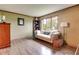 Cozy living room featuring hardwood floors, a comfy couch, and natural light at 1004 Nevelle Ln, Carmel, IN 46032