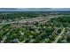 Aerial perspective of a suburban neighborhood featuring tree-lined streets, and convenient highway access at 1004 Nevelle Ln, Carmel, IN 46032