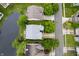Aerial view showcases roof, driveway and mature trees in this neighborhood at 11040 Brave Ct, Indianapolis, IN 46236