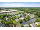 Aerial view highlights pond-side home near neighborhood amenities at 11040 Brave Ct, Indianapolis, IN 46236