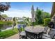 Backyard featuring patio furniture, swing set, pond, and ample space for outdoor activities at 11040 Brave Ct, Indianapolis, IN 46236