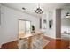 Dining room showcases hardwood floors, modern lighting, and open access to living space at 11040 Brave Ct, Indianapolis, IN 46236