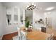 Dining Room featuring hardwood floors, natural lighting, and a view of the kitchen at 11040 Brave Ct, Indianapolis, IN 46236