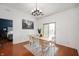 Bright dining room with hardwood floors, modern lighting, and a sliding glass door at 11040 Brave Ct, Indianapolis, IN 46236