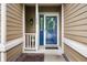 Up close view of front door featuring storm door, welcome mat, and a wreath at 11040 Brave Ct, Indianapolis, IN 46236