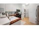Modern kitchen boasts white cabinets, wood countertops, stainless steel microwave, oven, and refrigerator at 11040 Brave Ct, Indianapolis, IN 46236