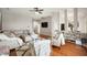 Bright living room featuring hardwood floors, neutral paint, and a comfortable sofa at 11040 Brave Ct, Indianapolis, IN 46236