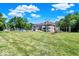 Sprawling backyard featuring a playset and pool, set against the backdrop of a well-manicured lawn at 11575 Freeport Dr, Carmel, IN 46032