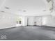 Expansive bonus room with wet bar, sink, and lots of natural light at 11575 Freeport Dr, Carmel, IN 46032