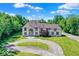 Stunning two-story home with a circular driveway and beautifully landscaped front yard at 11575 Freeport Dr, Carmel, IN 46032