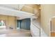 Elegant foyer with a curved staircase and a soaring ceiling. Beautiful tile and spacious entry at 11575 Freeport Dr, Carmel, IN 46032