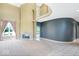 Inviting foyer with a graceful staircase, fireplace, and abundant natural light at 11575 Freeport Dr, Carmel, IN 46032