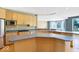 Modern kitchen with stainless steel appliances, wood cabinets and a central island at 11575 Freeport Dr, Carmel, IN 46032