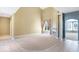 Spacious living room with vaulted ceiling, fireplace, and neutral carpet at 11575 Freeport Dr, Carmel, IN 46032