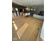 Modern living area with hardwood floors, pendant lighting, and an open floor plan at 11575 Freeport Dr, Carmel, IN 46032