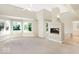 Bright main bedroom with large windows, a cozy fireplace, and a luxurious en-suite bathroom at 11575 Freeport Dr, Carmel, IN 46032