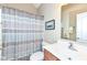 Well-lit bathroom with a shower and tub combination, vanity and framed mirror at 11692 Seven Oaks Dr, Fishers, IN 46038
