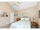 Comfortable bedroom with vaulted ceiling, complete with warm ambient lighting at 11692 Seven Oaks Dr, Fishers, IN 46038