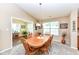 Cozy dining room with wood table, chair set, and vaulted ceiling at 11692 Seven Oaks Dr, Fishers, IN 46038