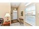Welcoming foyer featuring hardwood floors, a window for natural light, and decorative accents at 11692 Seven Oaks Dr, Fishers, IN 46038