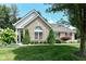 Charming stone home featuring a well-manicured lawn and established landscaping at 11692 Seven Oaks Dr, Fishers, IN 46038