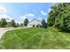 Well-manicured lawn and landscaping enhance this lovely home with a two-car garage and charming curb appeal at 11692 Seven Oaks Dr, Fishers, IN 46038