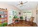 Inviting sun room with vaulted ceiling, wood floors, and ample natural light at 11692 Seven Oaks Dr, Fishers, IN 46038
