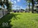 Large grassy backyard perfect for recreation and outdoor activities surrounded by trees at 1304 Franklin St, Columbus, IN 47201