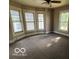 Bright bedroom featuring large windows and neutral carpeting for a calm space at 1304 Franklin St, Columbus, IN 47201