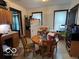 Cozy kitchen features wood cabinets, a round table, and abundant natural light at 1304 Franklin St, Columbus, IN 47201