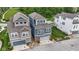 Aerial view of townhomes showcasing modern architecture, attached garages, and well-manicured lawns in a neighborhood at 13048 Minden Dr, Fishers, IN 46037