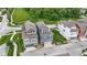 Aerial view of townhomes showcasing the yards, the community park, and streetscape at 13048 Minden Dr, Fishers, IN 46037