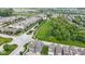 Aerial view of the neighborhood showcasing the community park, streets and school in the distance at 13048 Minden Dr, Fishers, IN 46037
